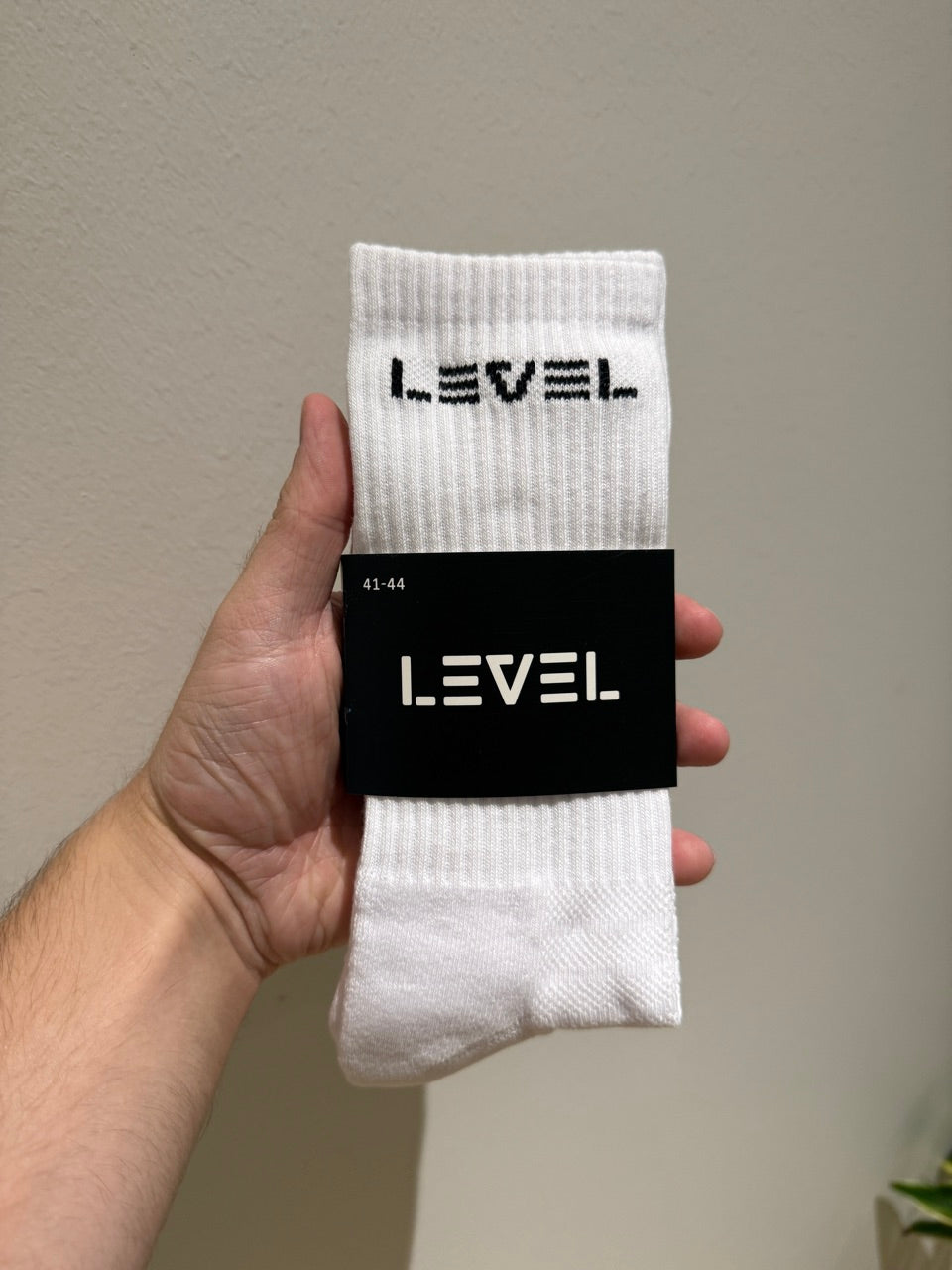Valkoiset urheilusukat Level-logolla